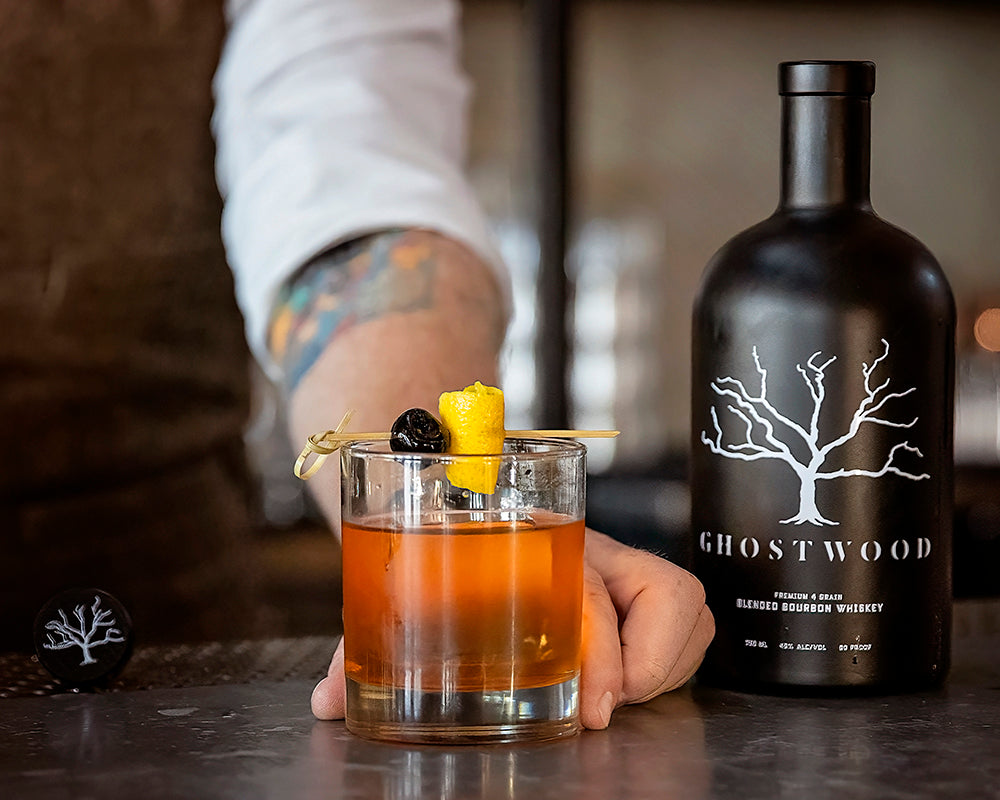 Ghostwood Blended Bourbon beside an Old Fashioned